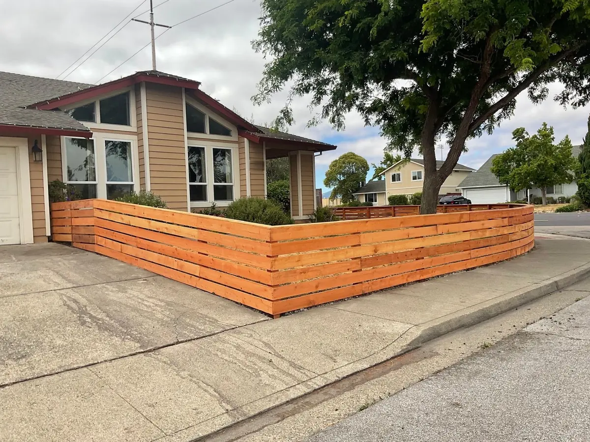Horizontal redwood fence around a corner lot