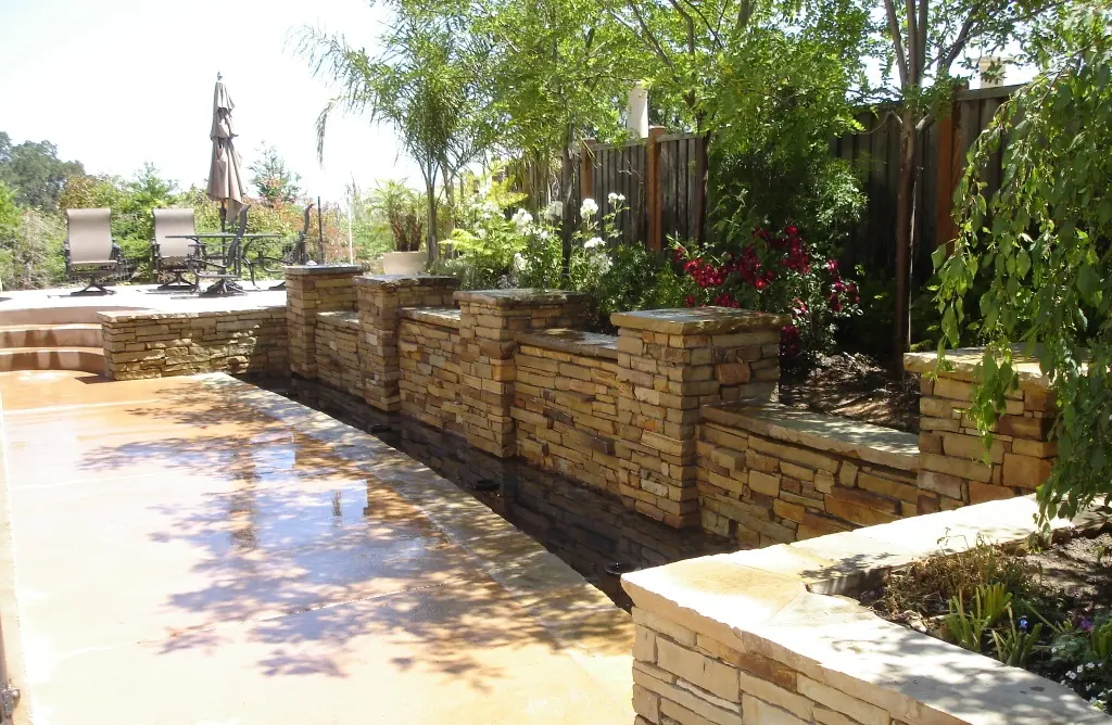 Stone planter walls along a patio